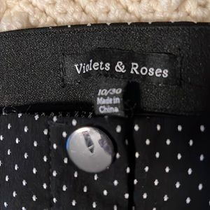 Size 10/30 career pants, never worn.  Black with white polka dots, stretchy.